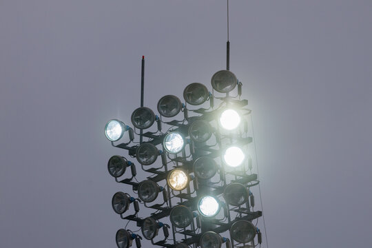 Stadium floodlights on a cloudy day
