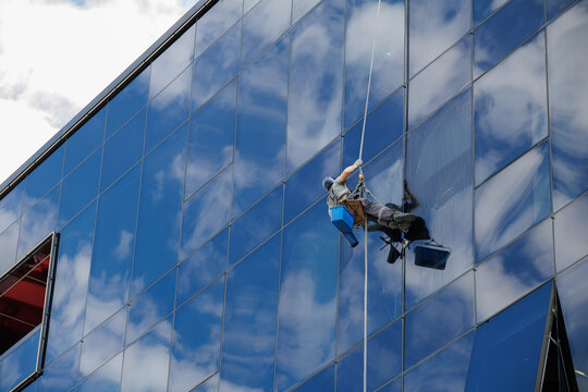 Commercial window cleaning specialist at work