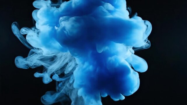 Light blue smoke rising in darkness with black background showcasing a simple display of color and movement during an experimental setting