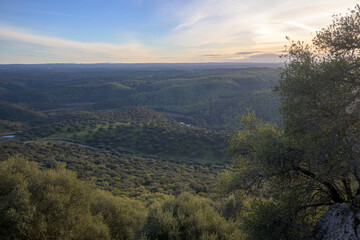 Sunset over green valley © MiguelA