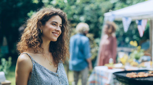 Friends enjoying backyard barbecue celebration, subtle patriotic atmosphere