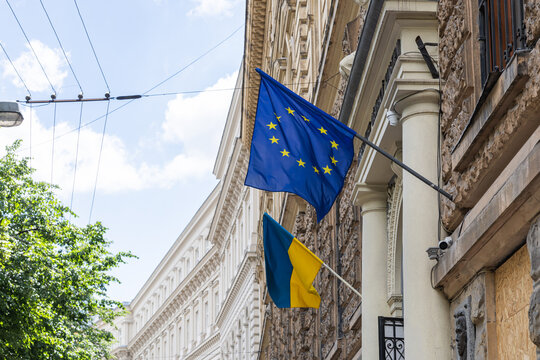 Ukrainian and European Union flags on building facade in Lviv Ukraine