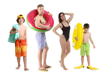 Fototapeta premium Family with kids in beachwear walking on white background