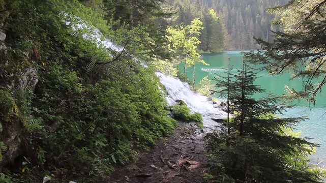Waterfall and a hiking trail around Crno jezero lake in Durmitor mountains, Montenegro