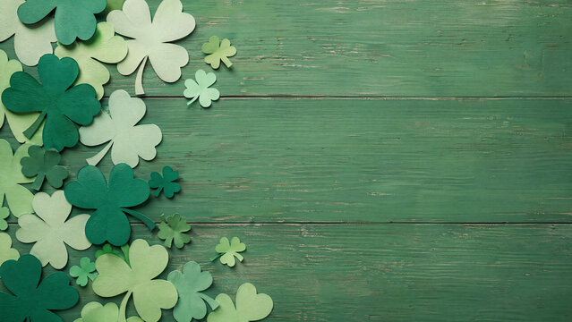 Green Shamrock Paper Cutouts on Wooden Background