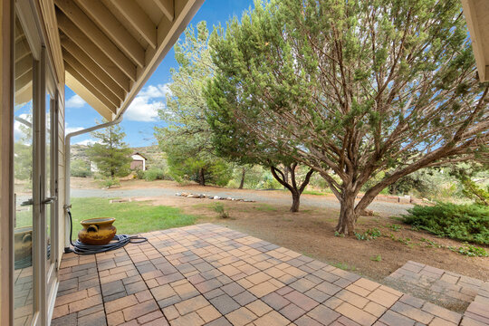 Patio with tiled surface and trees