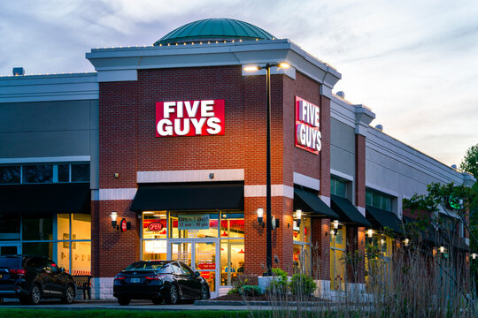 New Hartford, NY - May 26, 2026: Exterior of the Five Guys restaurant, part of Five Guys Enterprises LLC, a global fast‑casual burger chain founded in 1986 and operating more than 1,900 nationwide