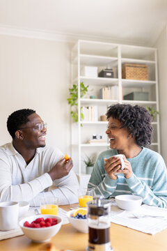 Happy enjoying breakfast and talking at home