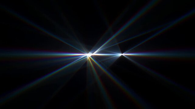 Static shot of light rays converging and producing lens flare across black background in studio with spectral reflections and horizontal streak motion