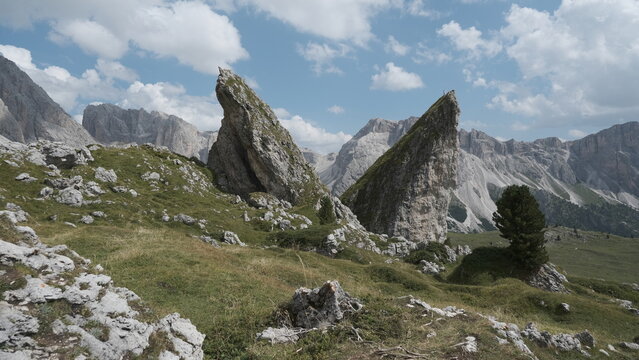 Twin rock fins formation with Dolomite mountain panorama, Vallunga, Val Gardena, South Tyrol, Italy
