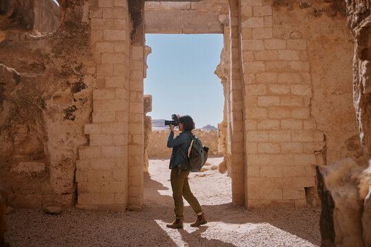 Exploring ancient ruins in Egypt's desert landscape during daylight