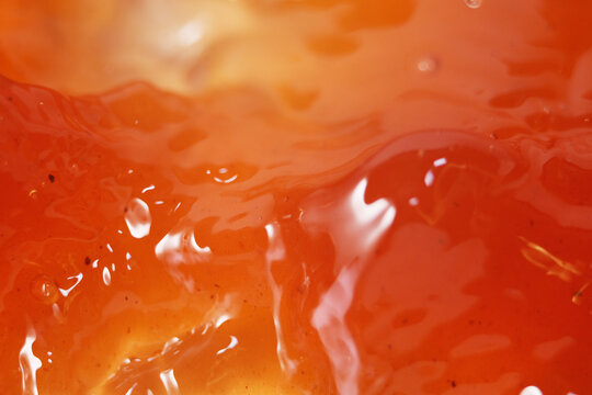 Close up of apple cider vinegar liquid. It made by fermenting apples can help with weight loss efforts, lower sugar cravings and reduce bloating
