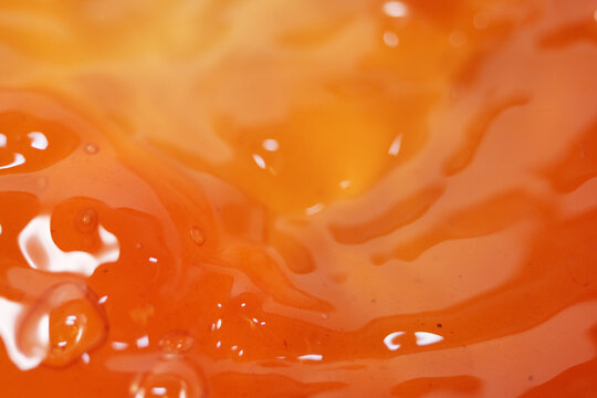 Close up of apple cider vinegar liquid. It made by fermenting apples can help with weight loss efforts, lower sugar cravings and reduce bloating