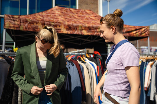 Trying on second hand jacket in Amsterdam