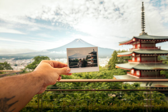 Holding Polaroid with Mount Fuji view