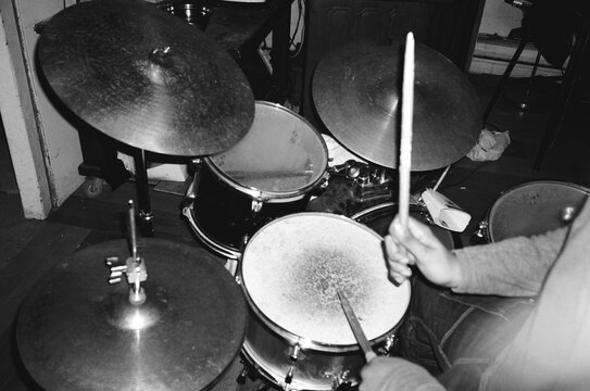 Overhead drummer in motion on film, raw rehearsal energy