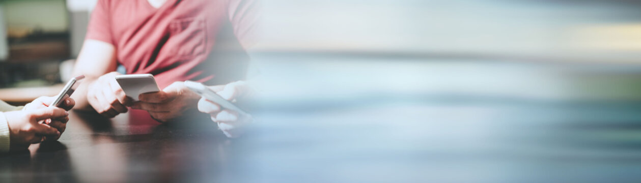 People hands using mobile phones; panoramic banner