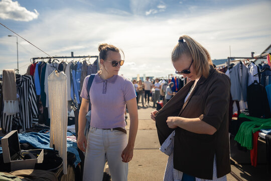 Trying vintage jacket at flea market