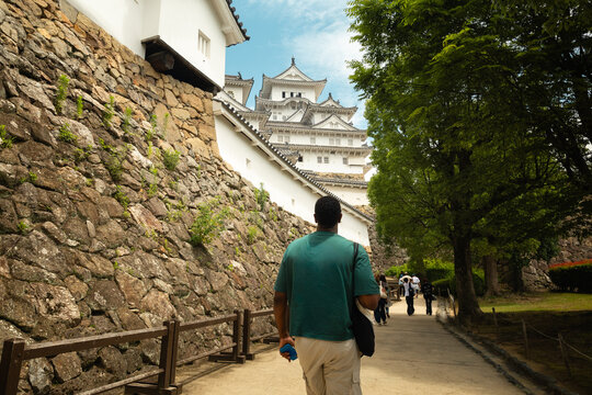 Traveler walking toward Himeji Castle