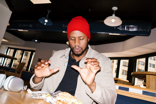 Man enjoying fast food meal in a restaurant