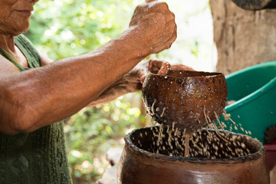 Close up of cacao drink preparation with flowing ingredients