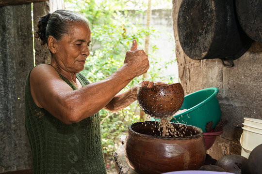 Woman enjoying the act of cacao drink preparation