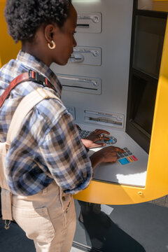 Woman using ATM keyboard 