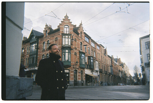 Man Stands on Street in BRUSSELS