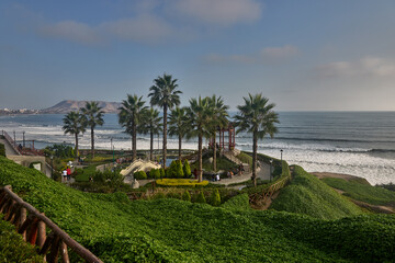 Fototapeta premium Few cities on Earth offer a skyline like this — where glass towers and ocean cliffs exist in the same breath. The sweeping panorama from the Malecón of Miraflores stretches south along Lima's entire P