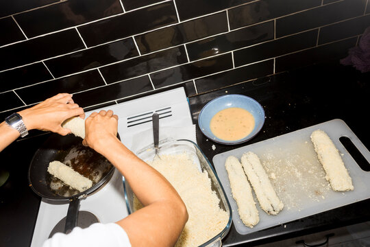 Breading sushi rolls before frying with direct flash