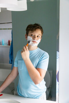 Portrait Teenager Lifestyle boy shaving first time