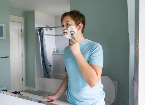 Portrait Teen Lifestyle boy shaving first time