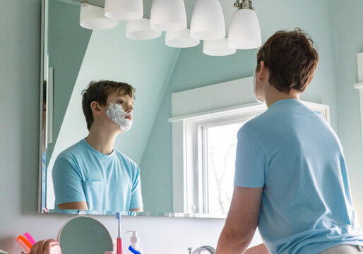 Handsome Teenager Lifestyle boy shaving first time