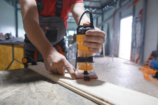 Joiner chamfers a board 