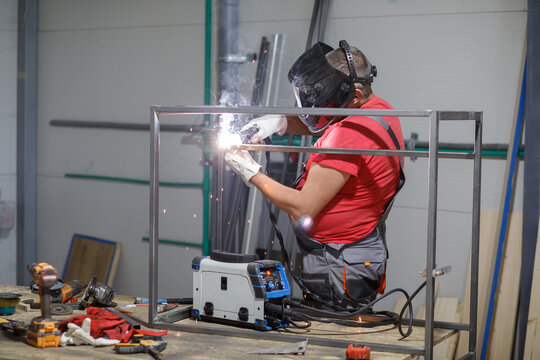 Welder welding steel construction