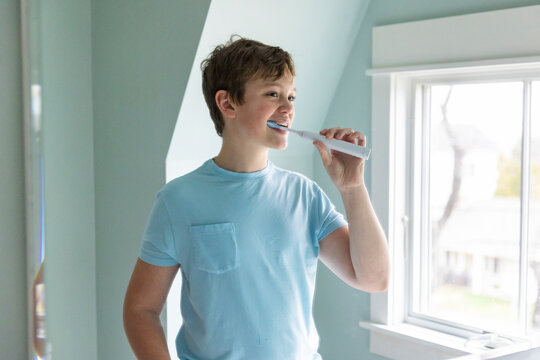 Portrait Teenager Lifestyle brushing teeth mirror 