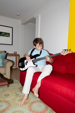 Teenager Lifestyle playing electric bass 
