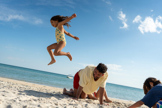 Joyful beach play with family