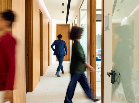 Business people on the move through the corporate space