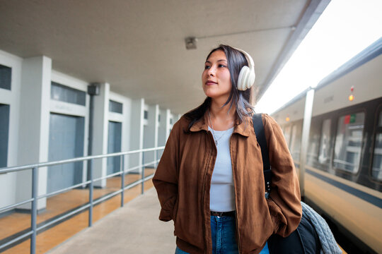 Woman walking on train station platform