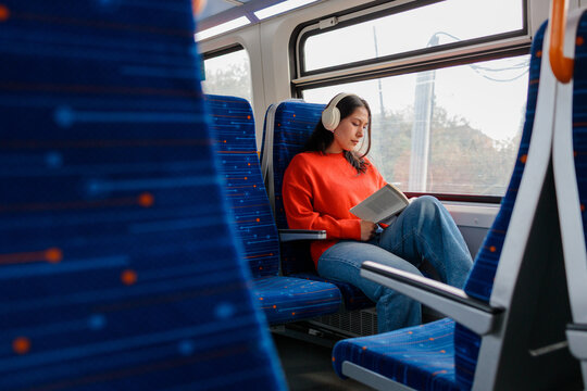 Passenger reading during train commute