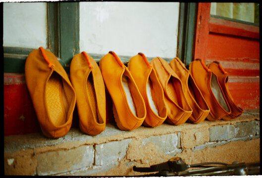 Bright Orange Shoes of the Monks Lined up at the Monastery 
