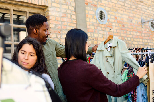 Friends Picking a Trench Coat