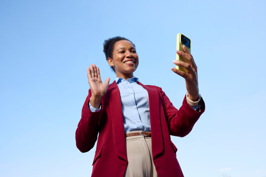 Woman communicates through a video call outside