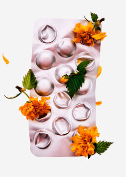 Blister pack of pills with flowers.

