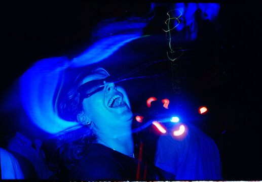 People Dancing at a Party With Lights and Laughter
