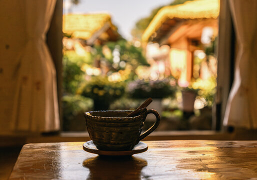 Tea in ceramic cup by window in Jeonju Hanok Village, South Korea