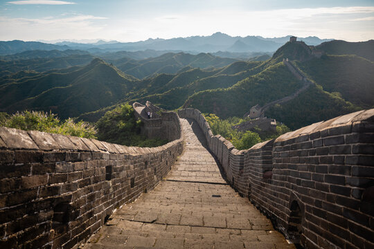 Two travelers walking the ancient Great Wall of China