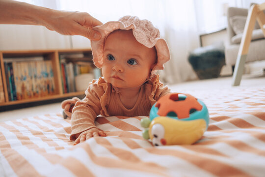 baby playing on floor.