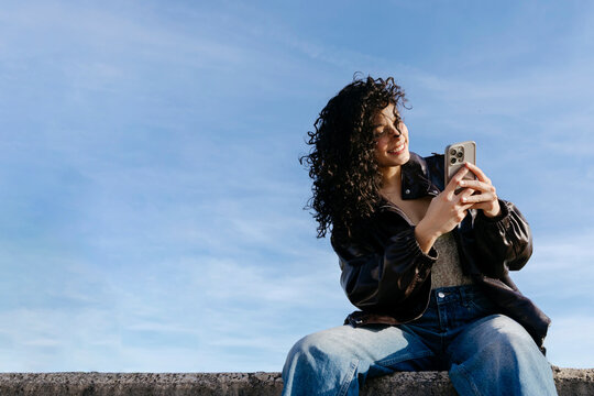 Woman using smartphone outdoors